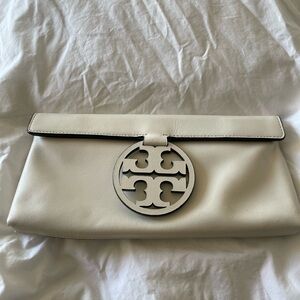 White color Tory Burch clutch with magnetic closure!